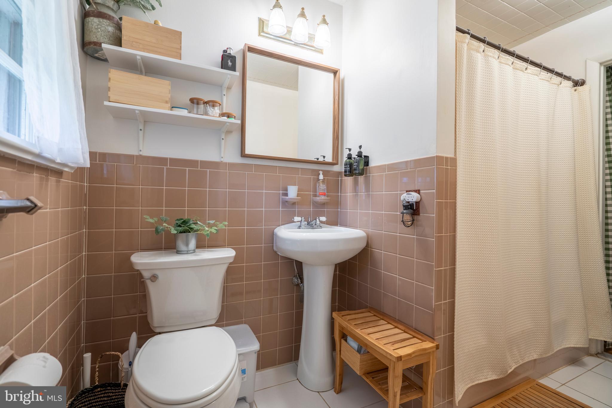 1066 Almshouse Road Ivyland, PA 18974 - Photo 23 of 39 a bathroom with a toilet sink and mirror