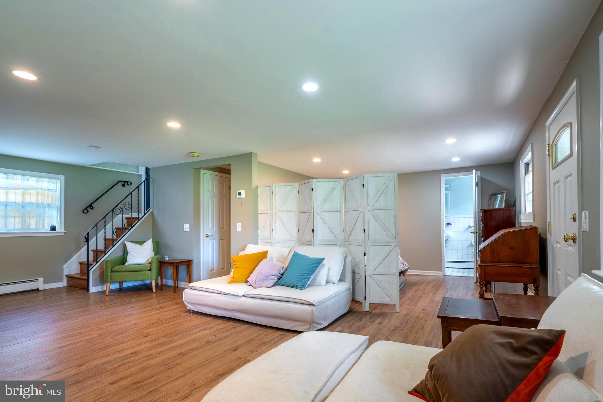 1066 Almshouse Road Ivyland, PA 18974 - Photo 27 of 39 a living room with furniture and wooden floor