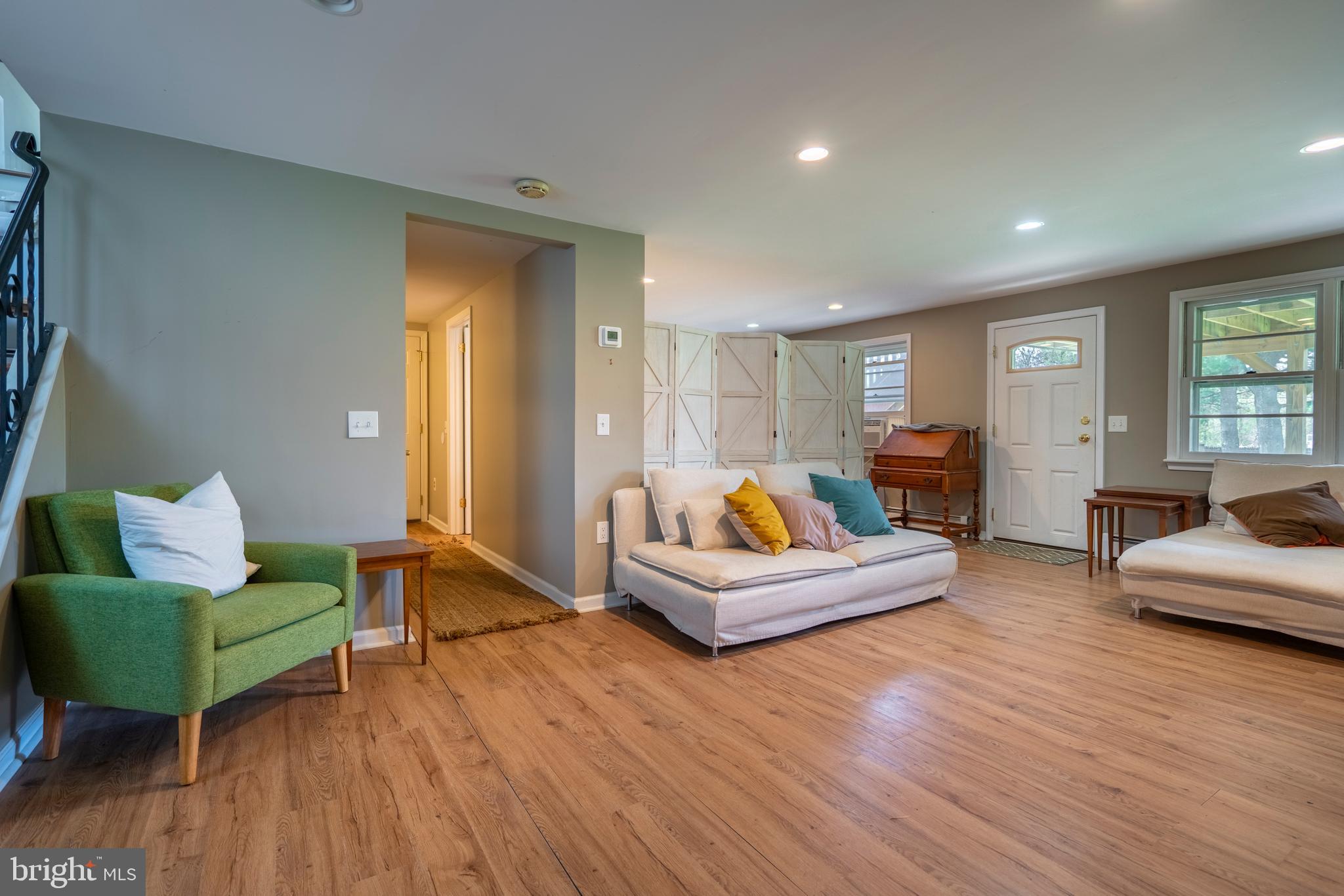 1066 Almshouse Road Ivyland, PA 18974 - Photo 28 of 39 a living room with furniture and a wooden floor
