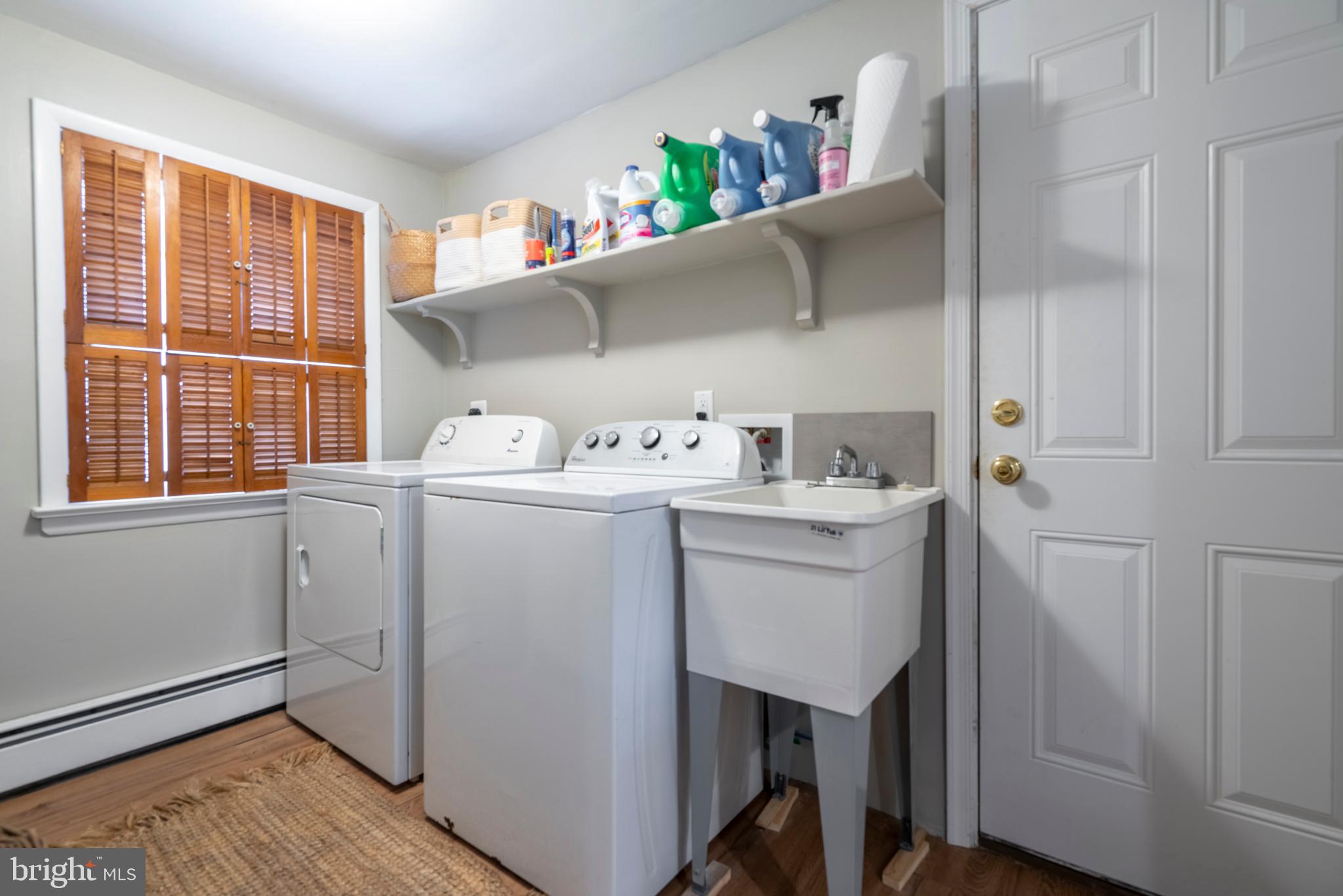 1066 Almshouse Road Ivyland, PA 18974 - Photo 32 of 39 a utility room with sink dryer and washer