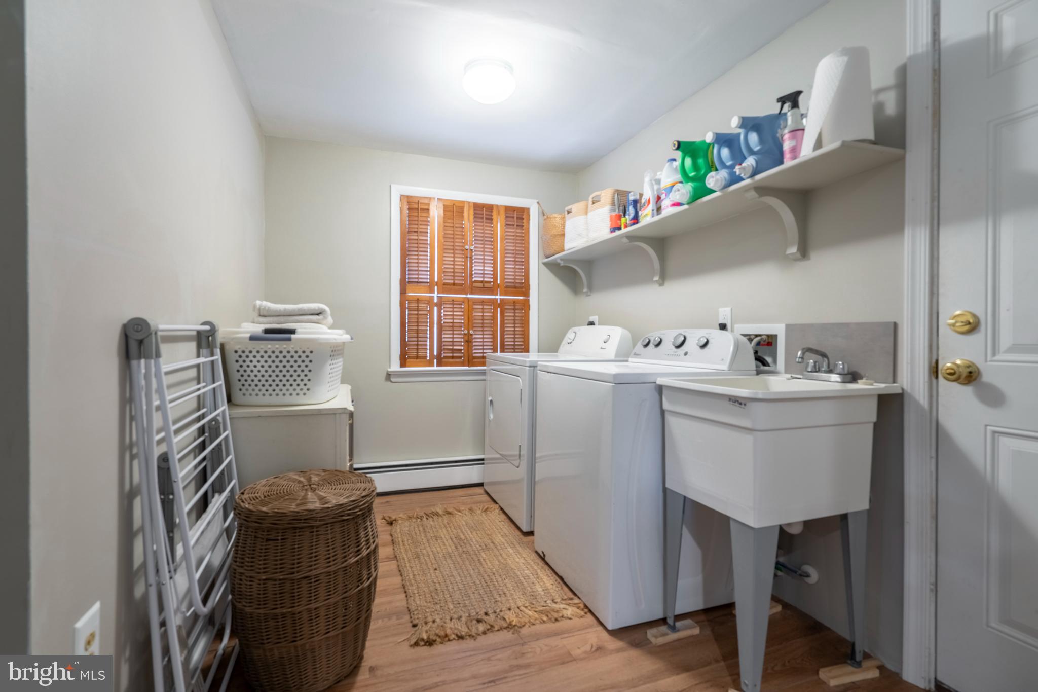 1066 Almshouse Road Ivyland, PA 18974 - Photo 33 of 39 a room with a sink cabinets and wooden floor