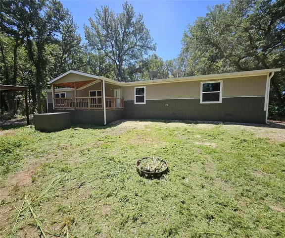 a house with trees in the background