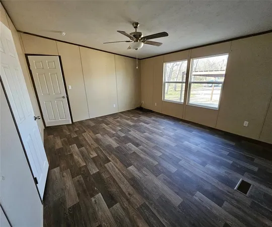 a view of an empty room with a window