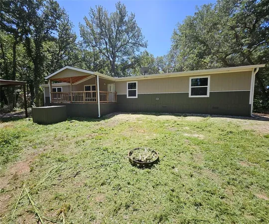 a house with trees in the background
