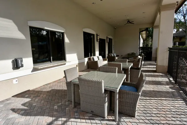 a kitchen with stainless steel appliances granite countertop a refrigerator a sink and a stove top oven