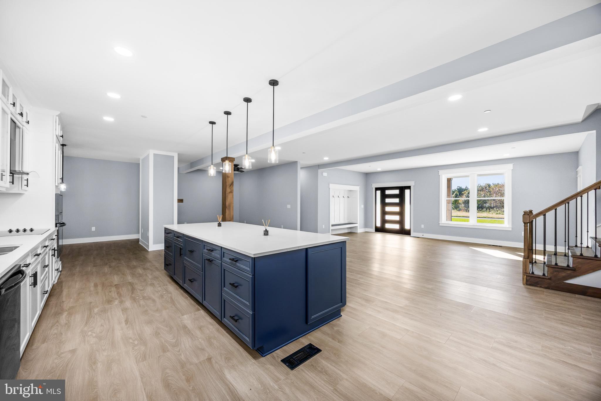 5692 King Stuart Drive Salisbury, MD 21801 - Photo 16 of 82 a large kitchen with stainless steel appliances granite countertop a large counter top a stove and a wooden floors