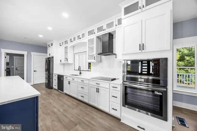 an empty room with wooden floor and closet