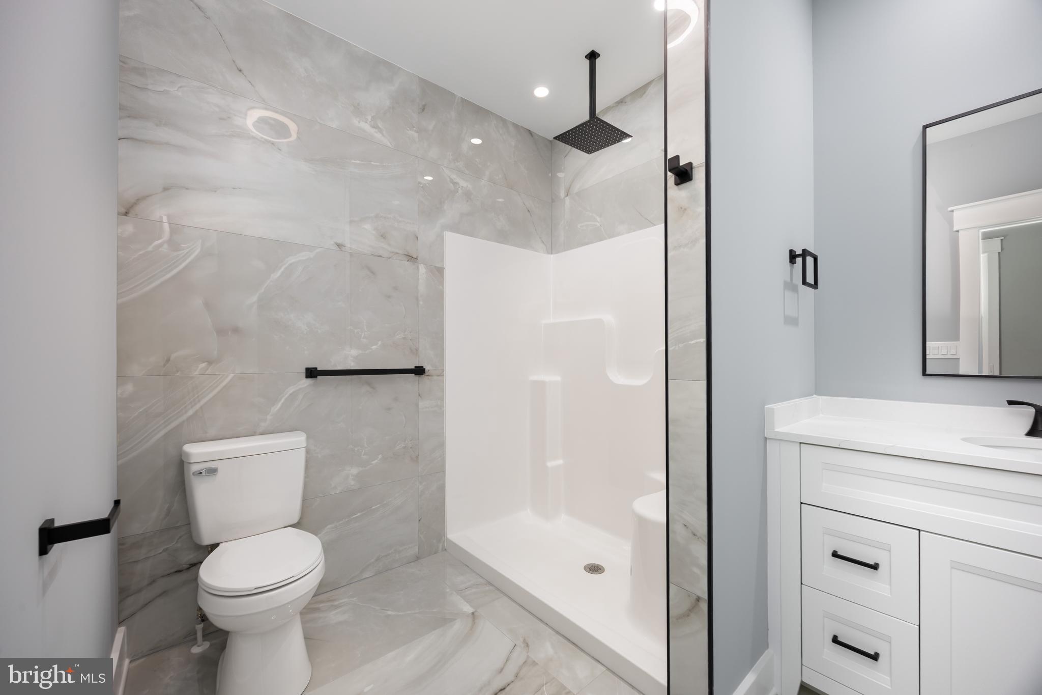 5692 King Stuart Drive Salisbury, MD 21801 - Photo 37 of 82 a bathroom with a toilet sink and a shower