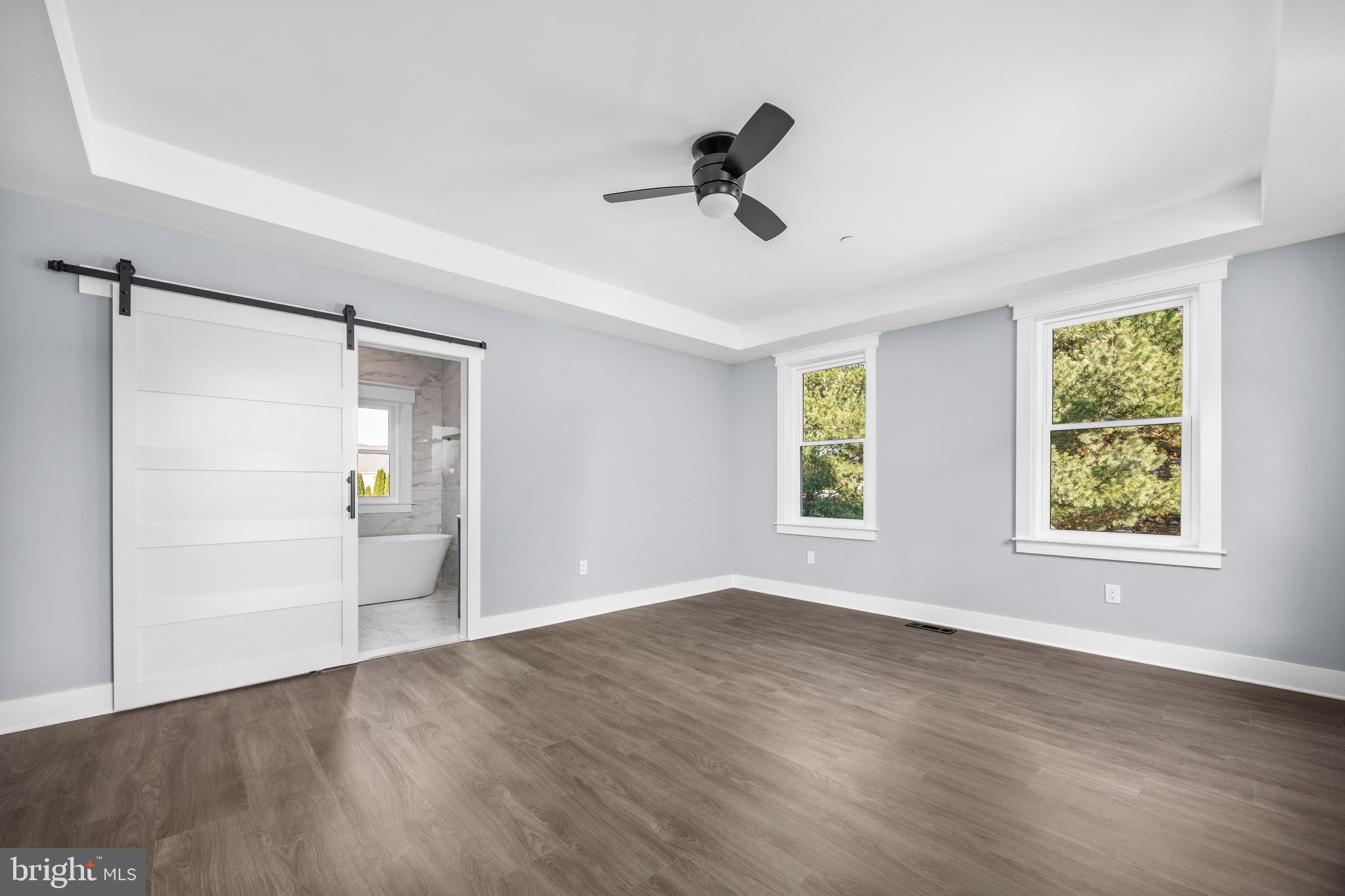 5692 King Stuart Drive Salisbury, MD 21801 - Photo 40 of 82 a view of an empty room with a window and wooden floor