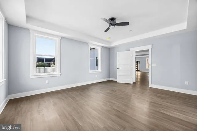 an empty room with wooden floor