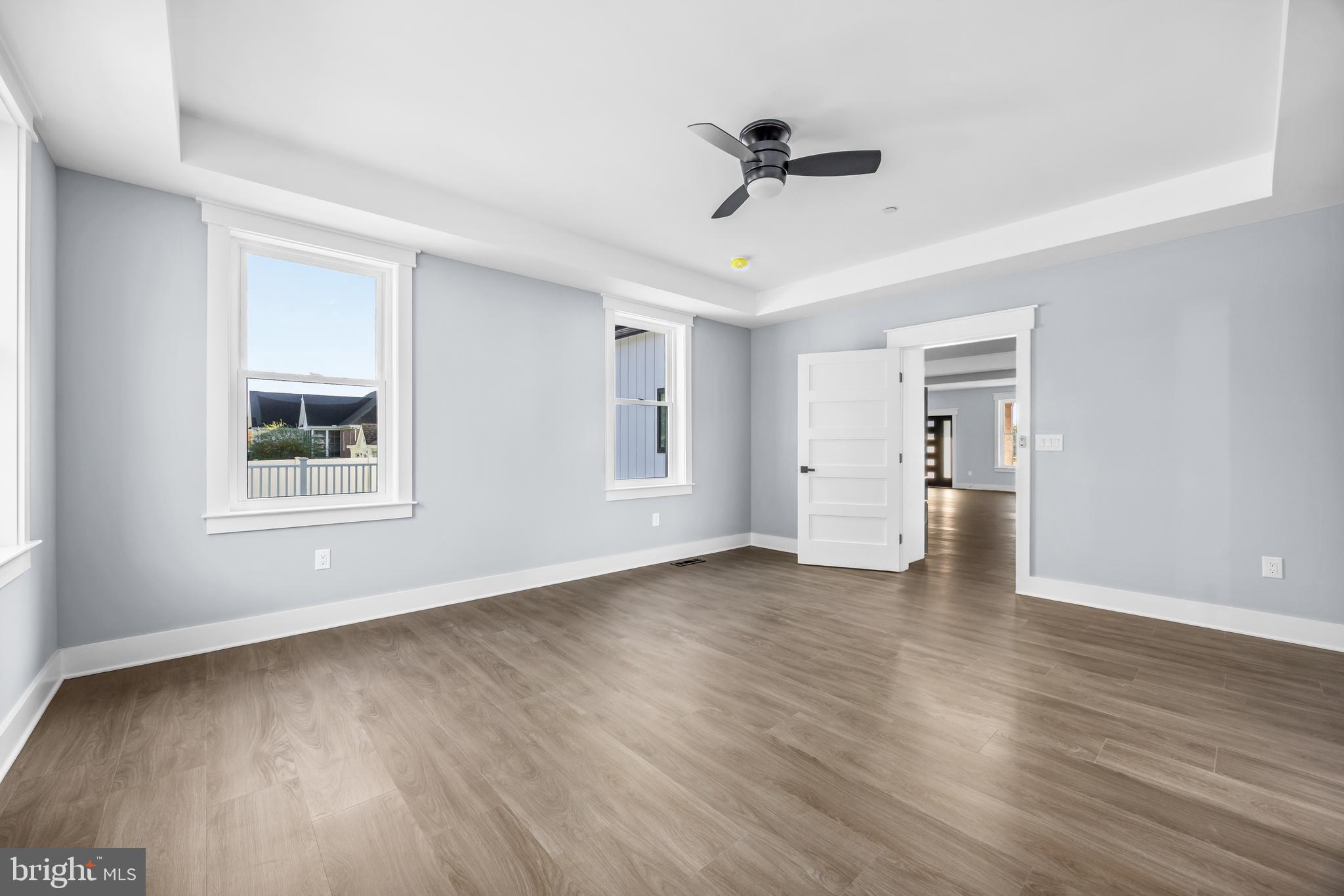 5692 King Stuart Drive Salisbury, MD 21801 - Photo 42 of 82 a view of an empty room with a window and wooden floor
