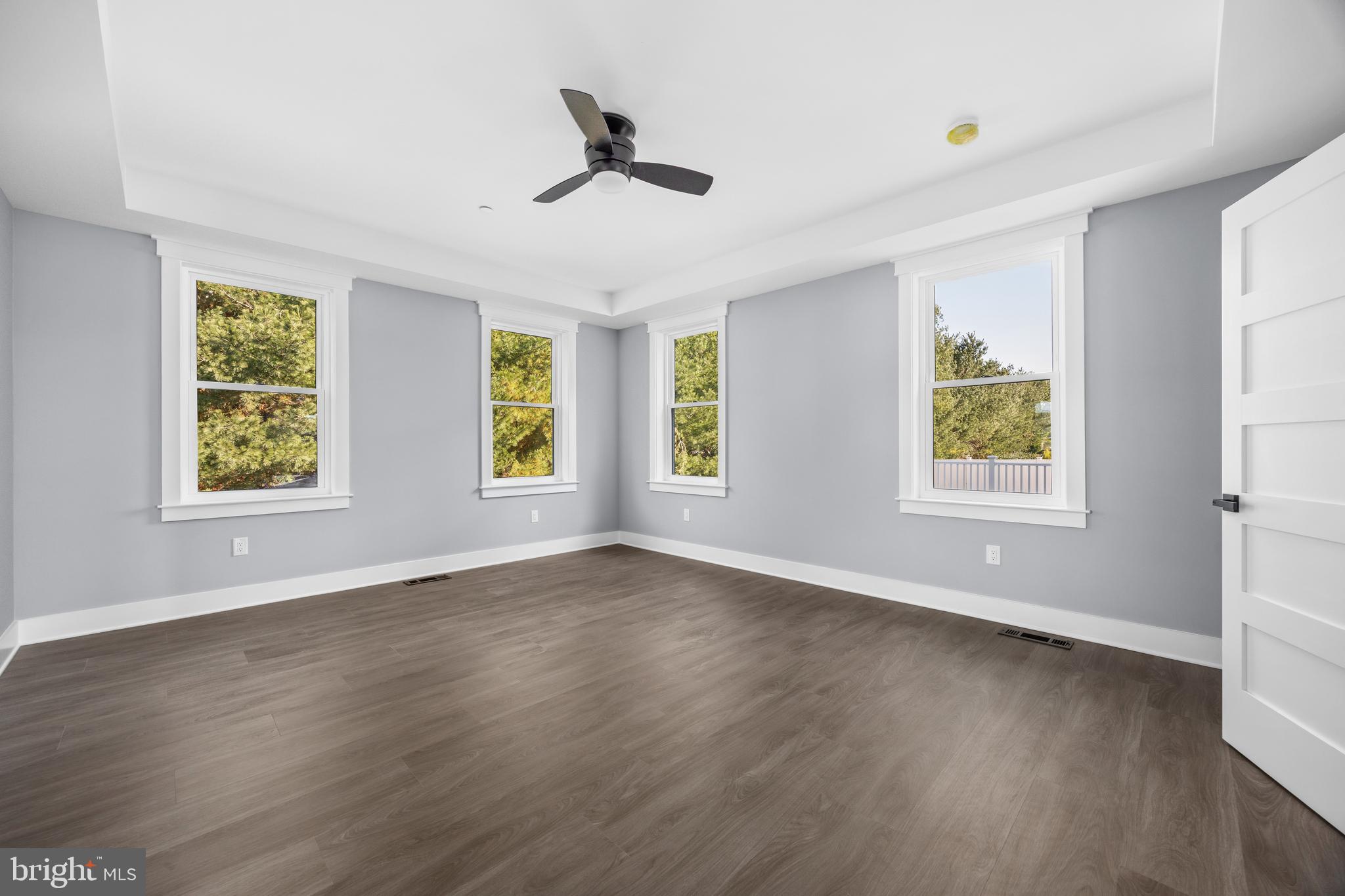 5692 King Stuart Drive Salisbury, MD 21801 - Photo 43 of 82 a view of an empty room with window and wooden floor