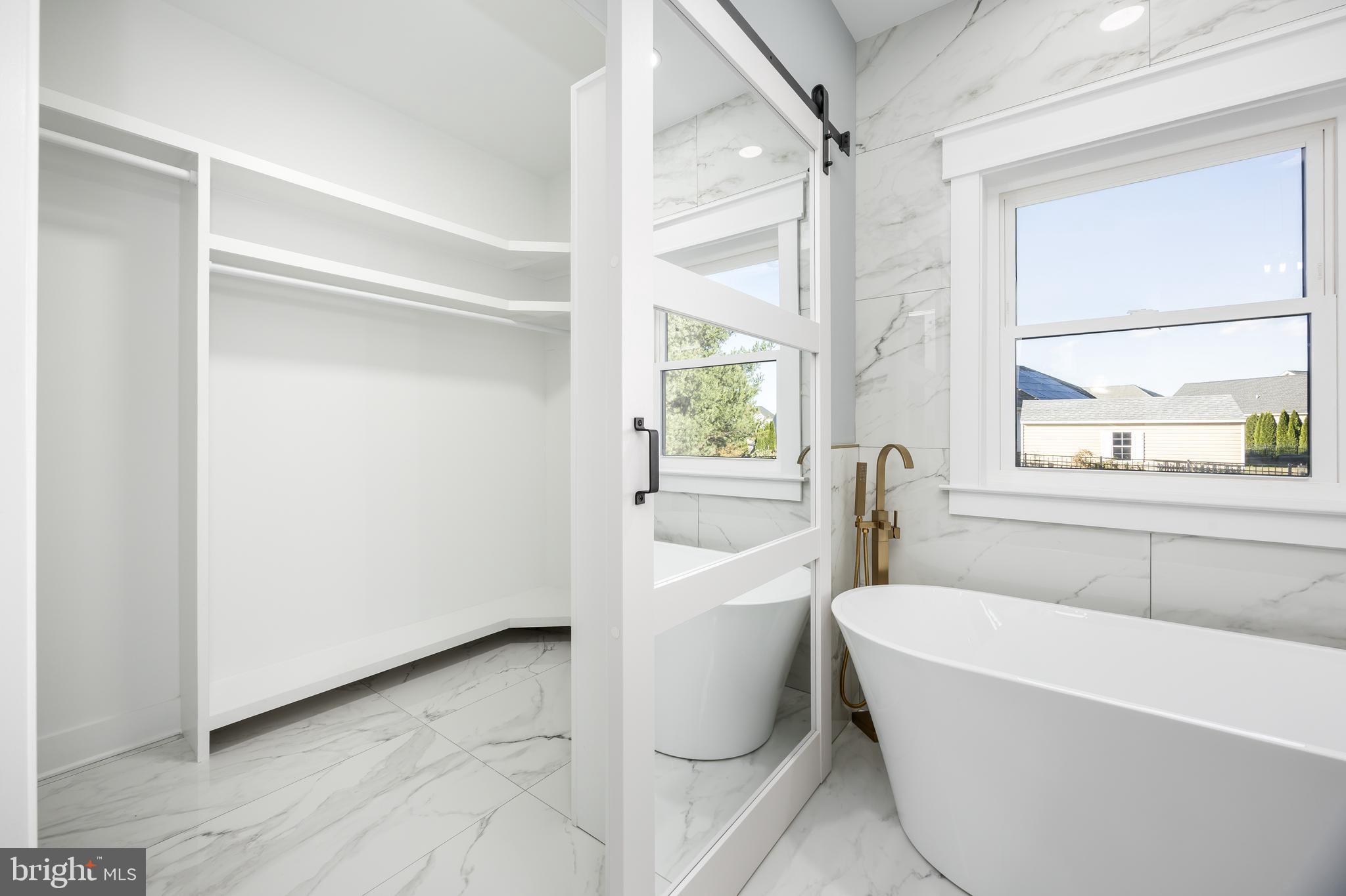 5692 King Stuart Drive Salisbury, MD 21801 - Photo 45 of 82 a bathroom with a bathtub and a shower