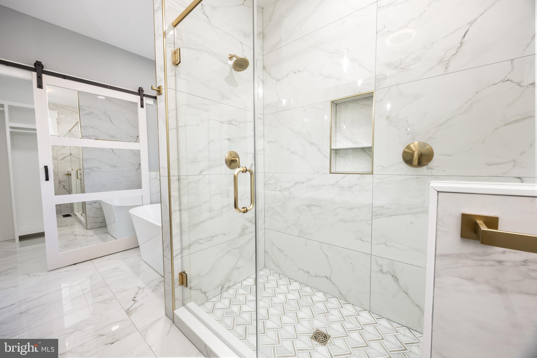 5692 King Stuart Drive Salisbury, MD 21801 - Photo 50 of 82 a bathroom with a glass shower door