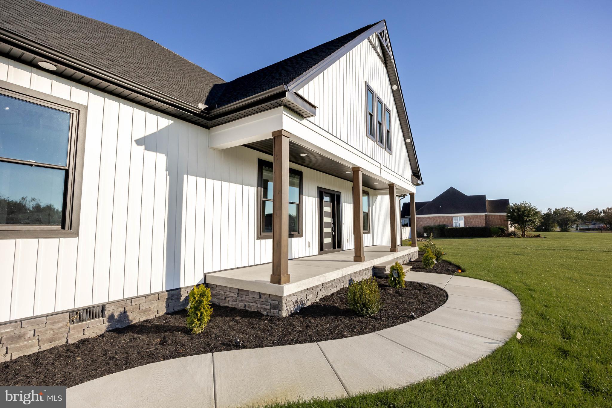 5692 King Stuart Drive Salisbury, MD 21801 - Photo 5 of 82 a front view of a house with a yard