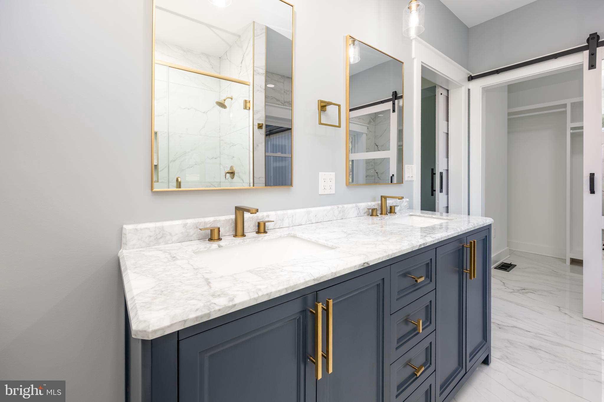 5692 King Stuart Drive Salisbury, MD 21801 - Photo 51 of 82 a bathroom with a granite countertop sink and a mirror