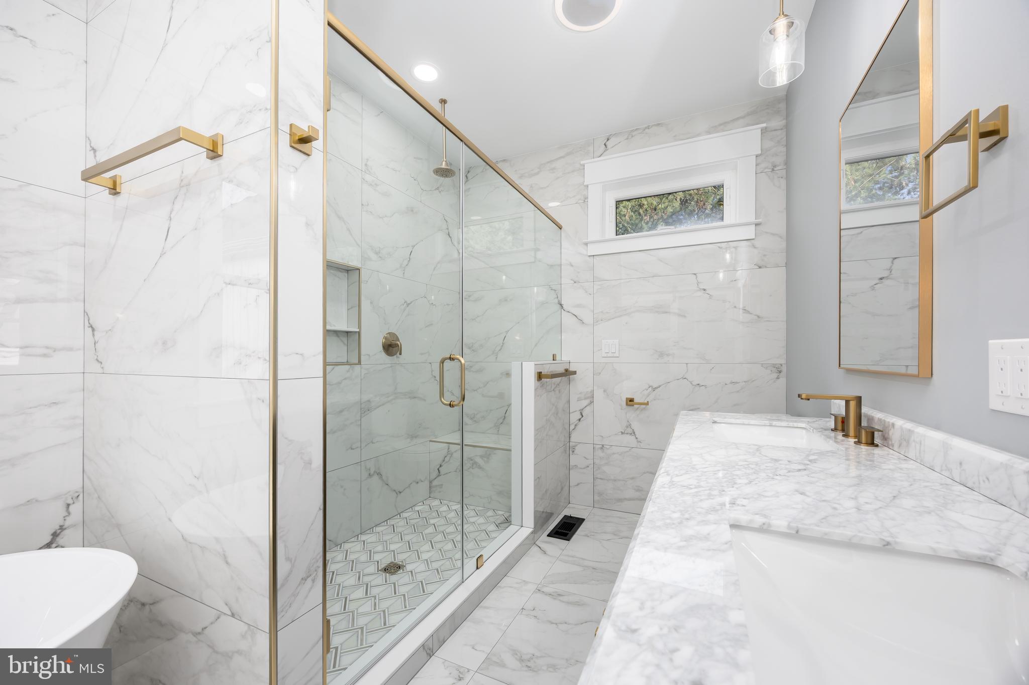 5692 King Stuart Drive Salisbury, MD 21801 - Photo 52 of 82 a bathroom with a granite countertop shower sink and mirror