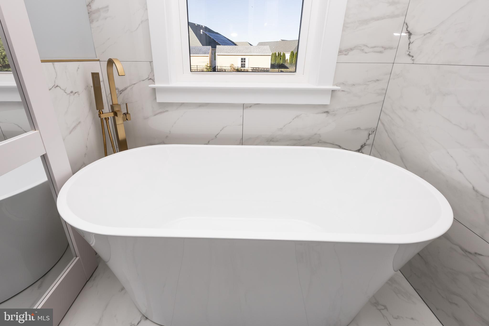 5692 King Stuart Drive Salisbury, MD 21801 - Photo 53 of 82 a close up of a bathtub in a bathroom