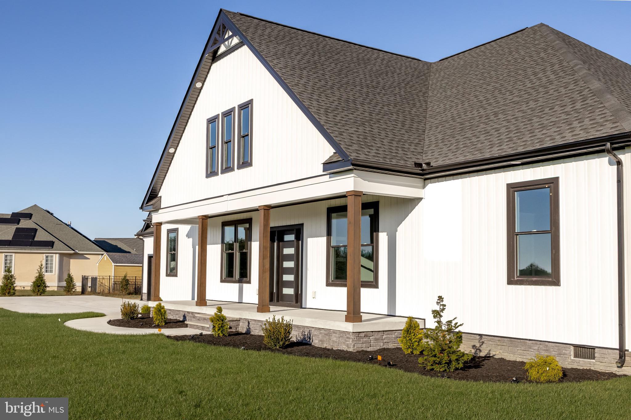 5692 King Stuart Drive Salisbury, MD 21801 - Photo 6 of 82 a front view of a house with a yard