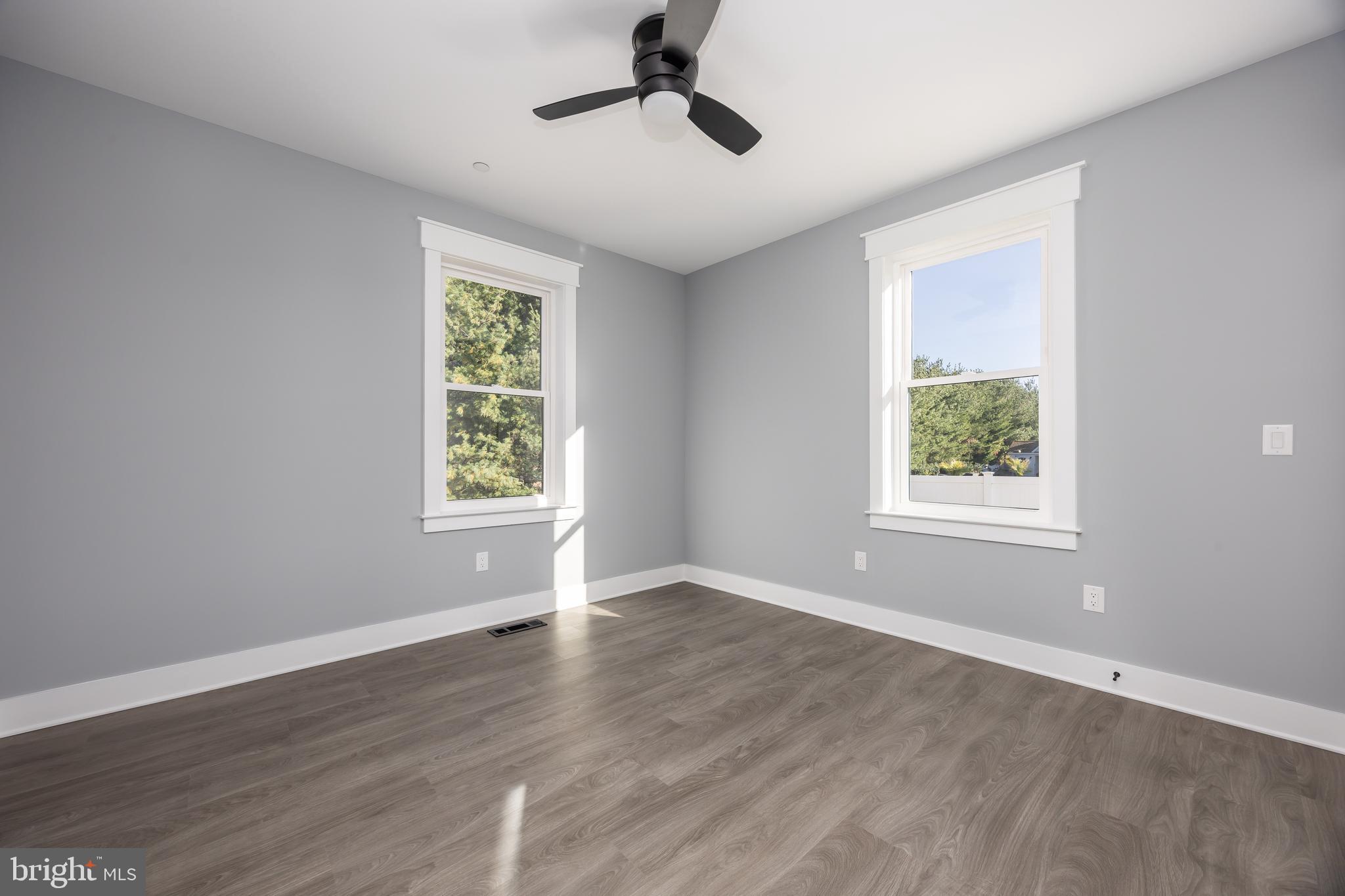 5692 King Stuart Drive Salisbury, MD 21801 - Photo 66 of 82 a view of an empty room with wooden floor and a window