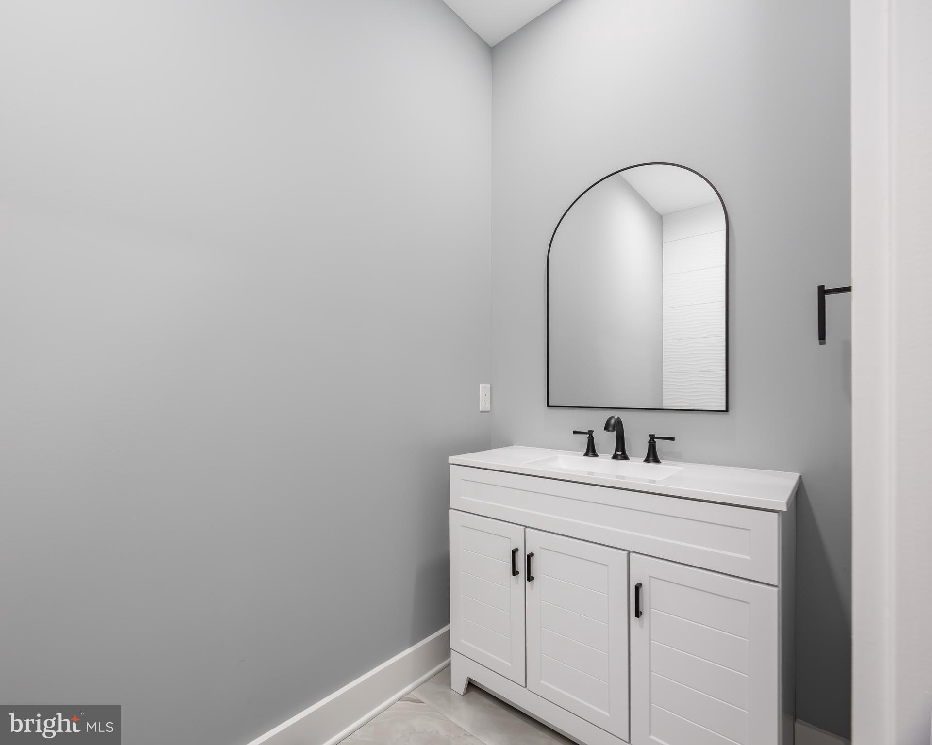 5692 King Stuart Drive Salisbury, MD 21801 - Photo 69 of 82 a bathroom with a sink and a mirror