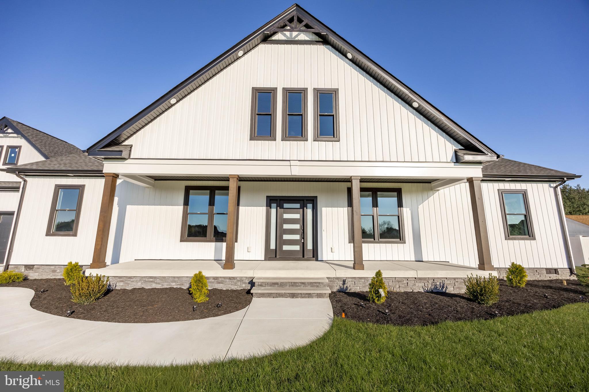 5692 King Stuart Drive Salisbury, MD 21801 - Photo 7 of 82 a front view of a house with garden