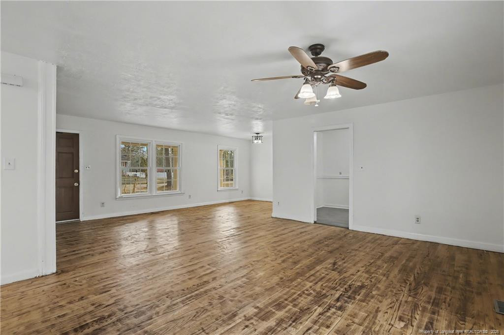 347 Forest Road Lumberton, NC 28358 - Photo 17 of 45 a view of an empty room with window and wooden floor