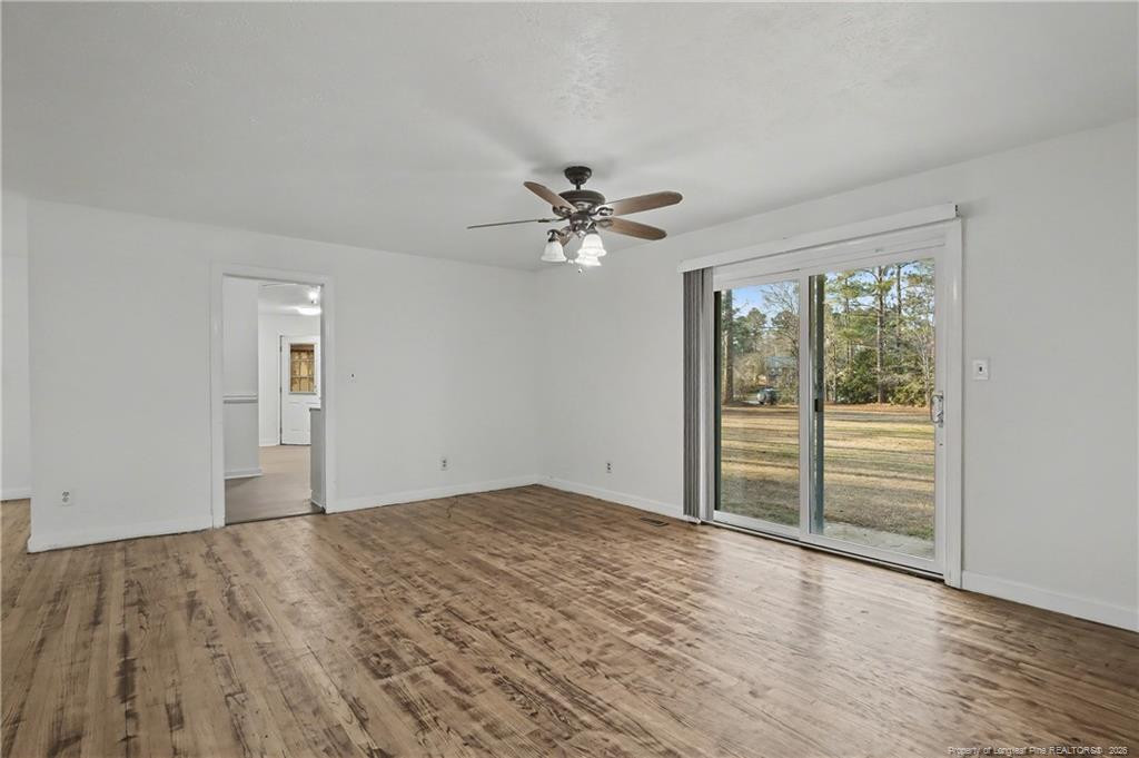 347 Forest Road Lumberton, NC 28358 - Photo 18 of 45 wooden floor in an empty room with a window