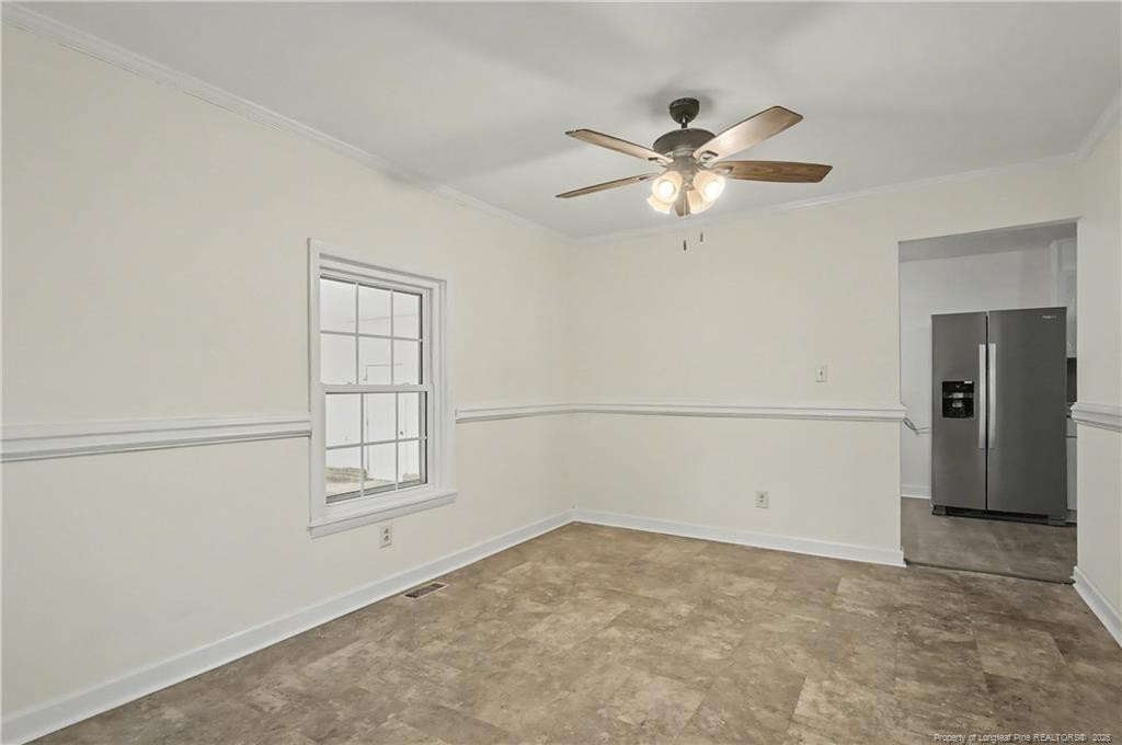 347 Forest Road Lumberton, NC 28358 - Photo 24 of 45 an empty room with windows and fan