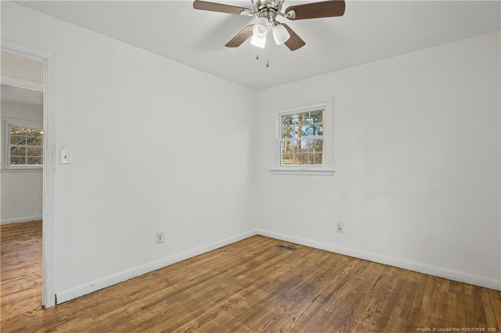 347 Forest Road Lumberton, NC 28358 - Photo 28 of 45 wooden floor in an empty room with a window
