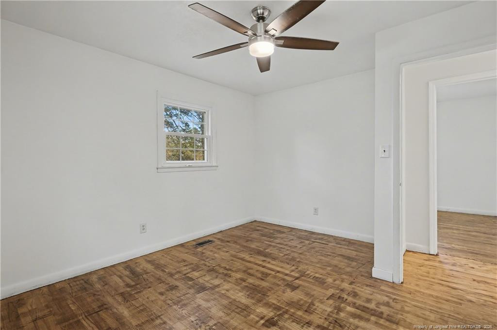 347 Forest Road Lumberton, NC 28358 - Photo 39 of 45 a view of empty room with wooden floor