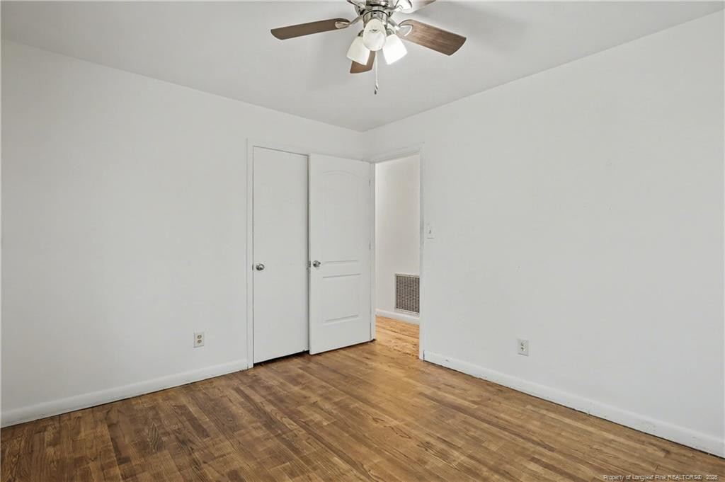 347 Forest Road Lumberton, NC 28358 - Photo 45 of 45 a view of a room with wooden floor and ceiling fan