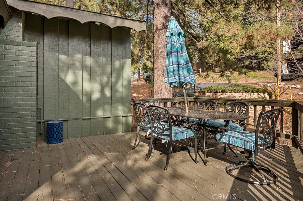 30789 All View Drive Running Springs, CA 92382 - Photo 11 of 25 a view of a chairs and table in the patio