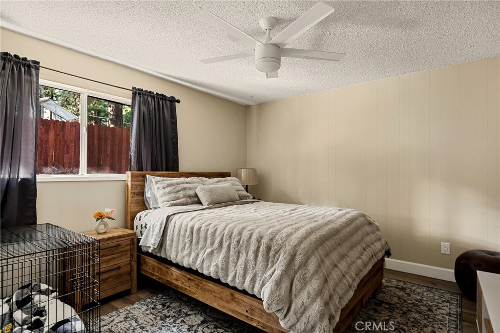 30789 All View Drive Running Springs, CA 92382 - Photo 20 of 25 a bedroom with a bed and wooden floor