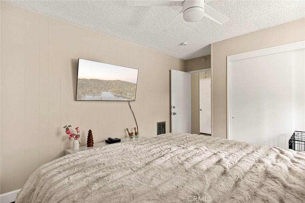 30789 All View Drive Running Springs, CA 92382 - Photo 21 of 25 a bedroom with a bed and a window