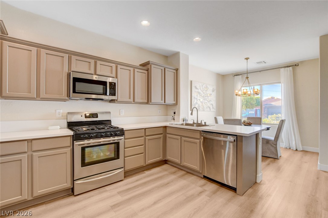 2649 Rue Marquette Avenue Henderson, NV 89044 - Photo 21 of 55 This chef-ready kitchen features ample counter space, modern appliances, and a seamless flow into the dining area.