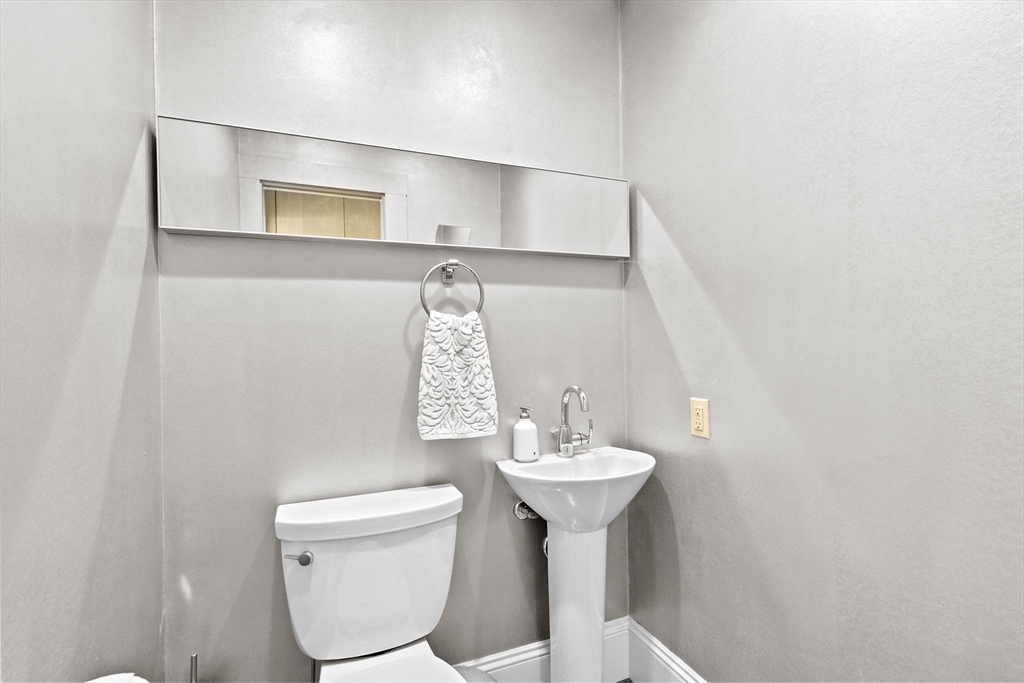 26 Saxon Road Newton, MA 02461 - Photo 12 of 25 a bathroom with a sink toilet and mirror