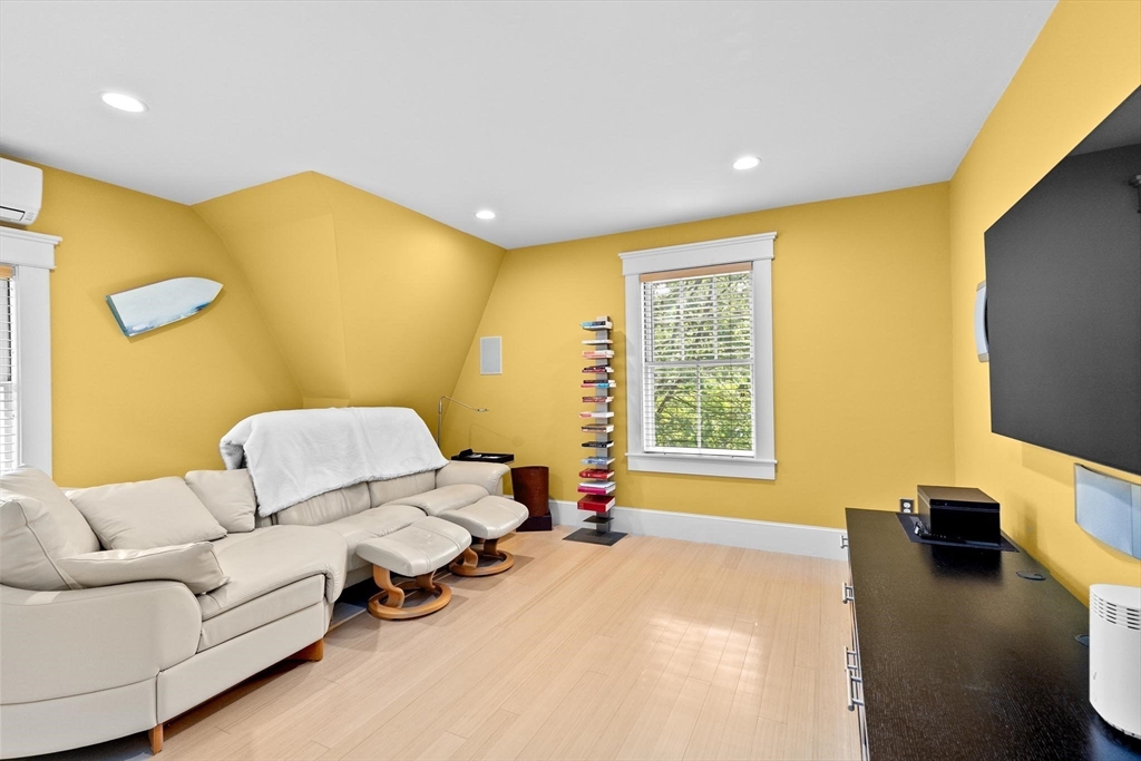 26 Saxon Road Newton, MA 02461 - Photo 18 of 25 a bedroom with a bed and a flat screen tv