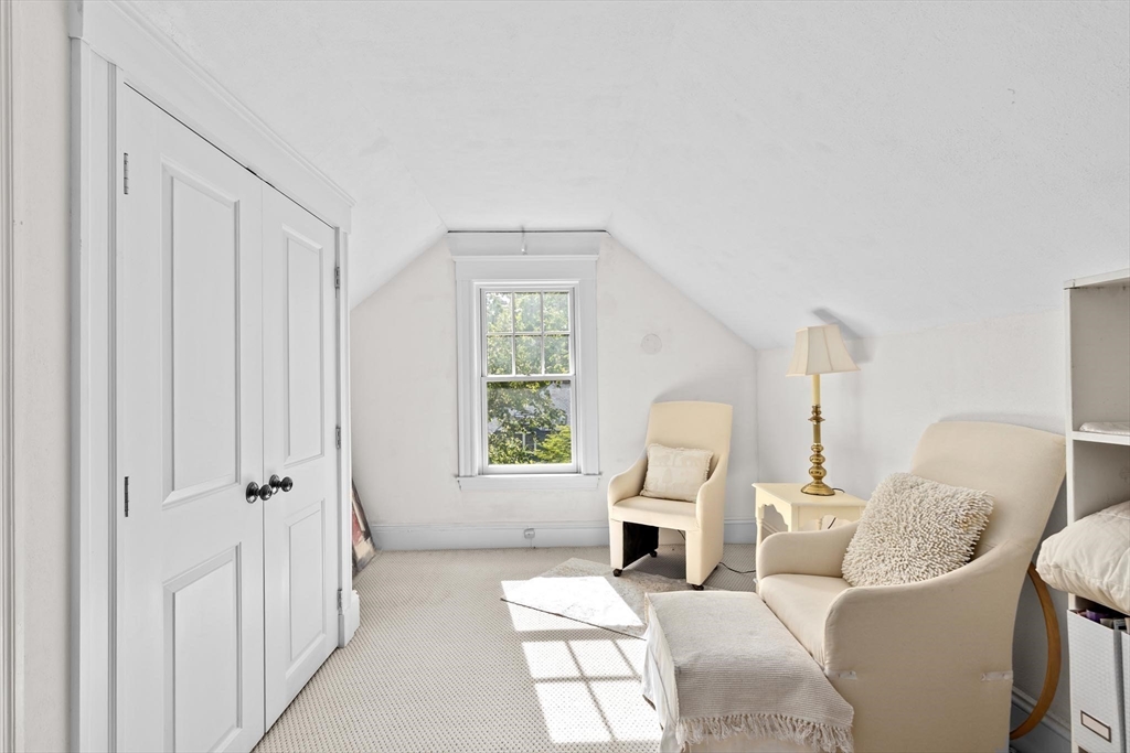 26 Saxon Road Newton, MA 02461 - Photo 20 of 25 a living room with furniture a window and a fireplace