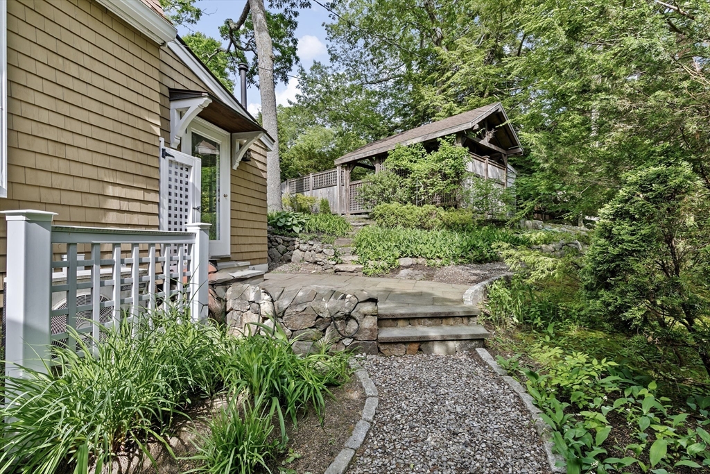 26 Saxon Road Newton, MA 02461 - Photo 23 of 25 a backyard of a house with lots of green space