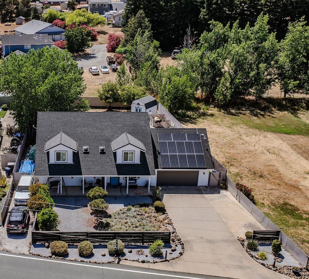 a aerial view of a house with a yard