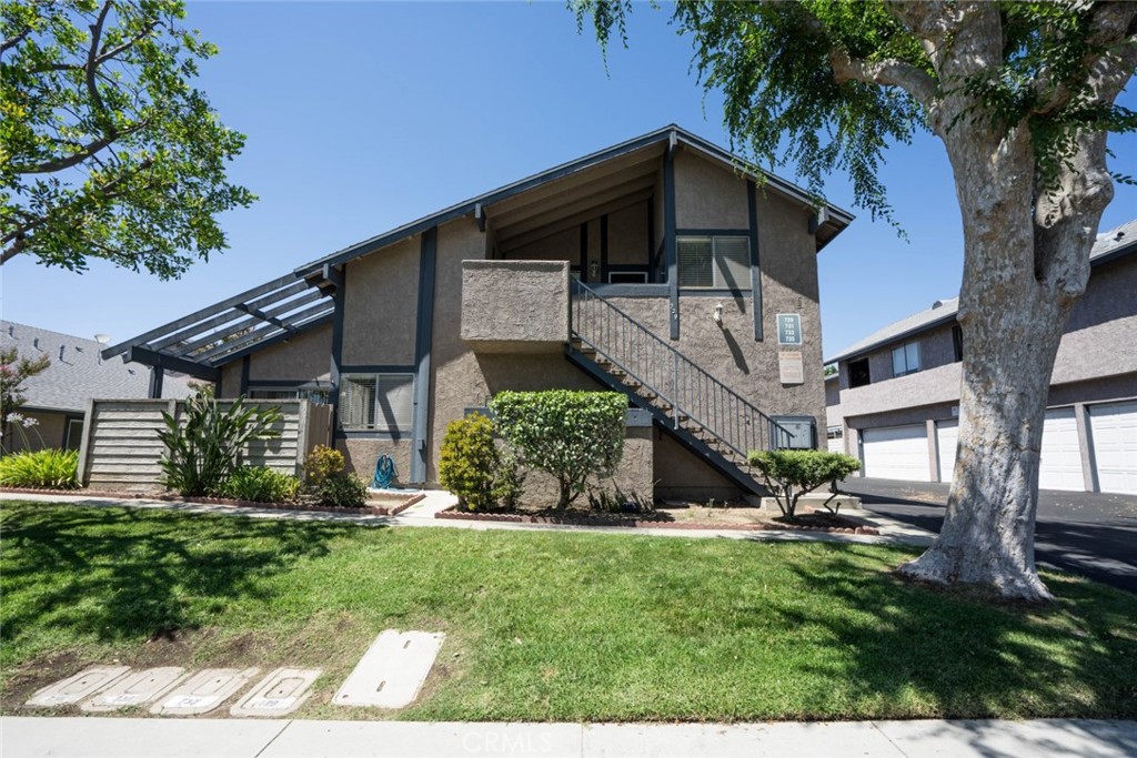 731 Windwood Drive Walnut, CA 91789 - Photo 1 of 15 a view of a house with a yard plants and large tree