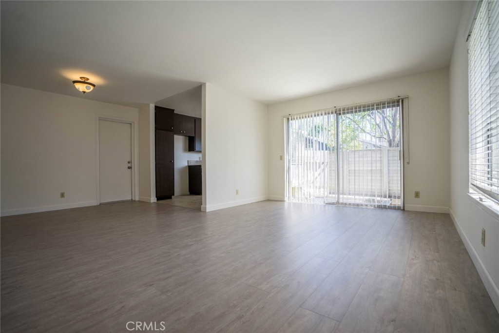 731 Windwood Drive Walnut, CA 91789 - Photo 4 of 15 an empty room with wooden floor and windows