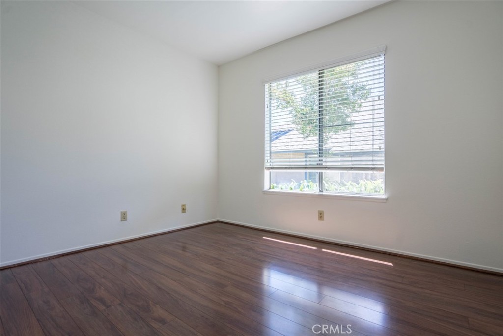 731 Windwood Drive Walnut, CA 91789 - Photo 9 of 15 a view of an empty room with wooden floor and a window