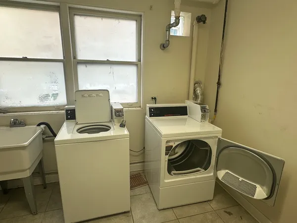 a utility room with dryer and washer