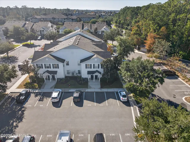 an aerial view of a house with swimming pool