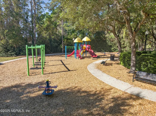 a view of a swimming pool and outdoor seating