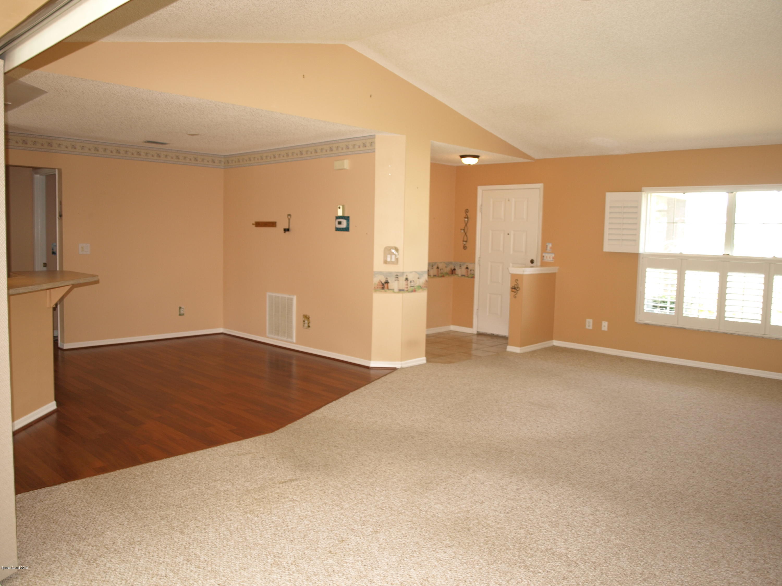 283 Twin Lakes Road Melbourne, FL 32901 - Photo 3 of 42 Living/Dining/Front Entrance