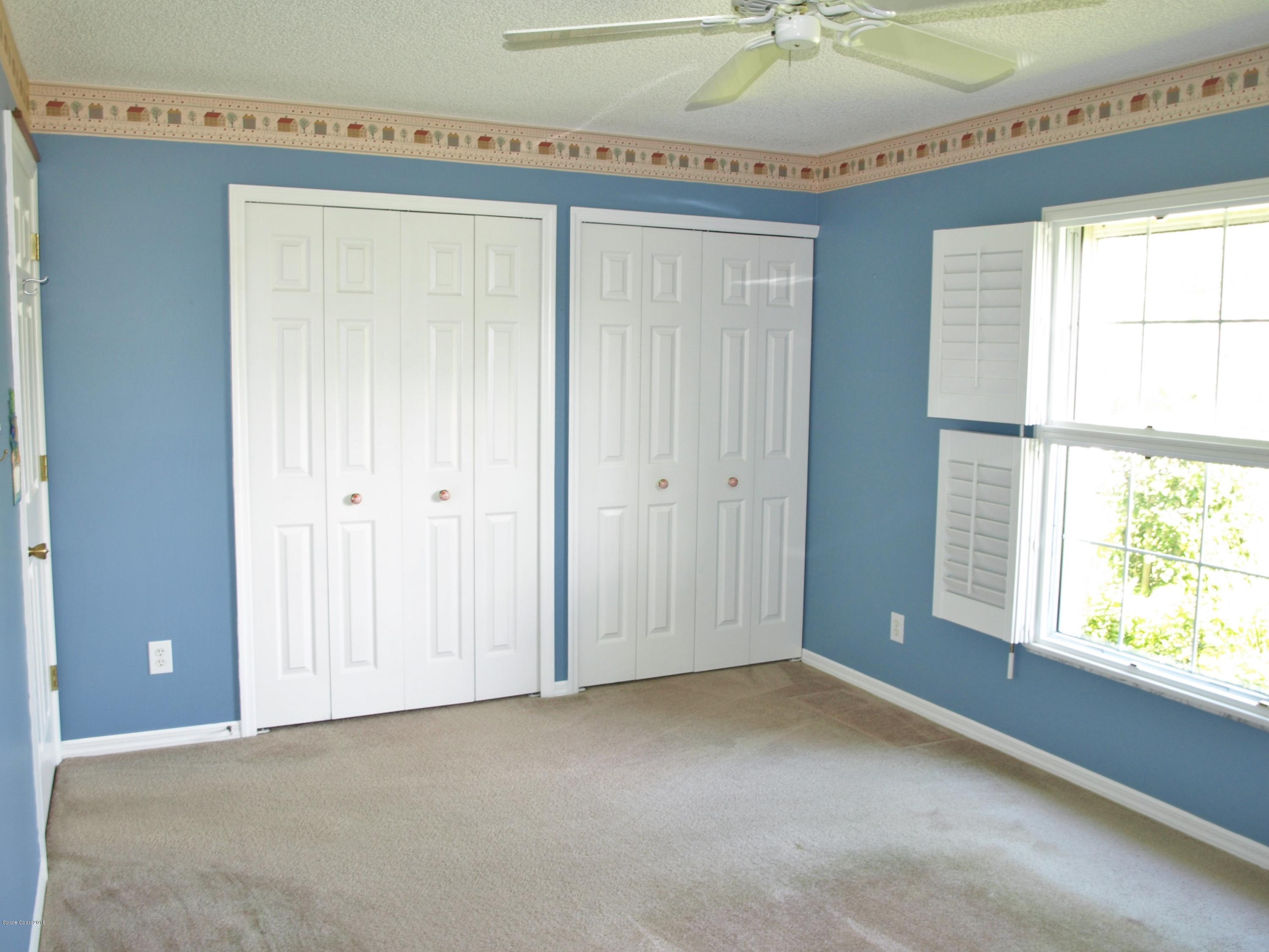 283 Twin Lakes Road Melbourne, FL 32901 - Photo 22 of 42 Front Bedroom w/Double Closets