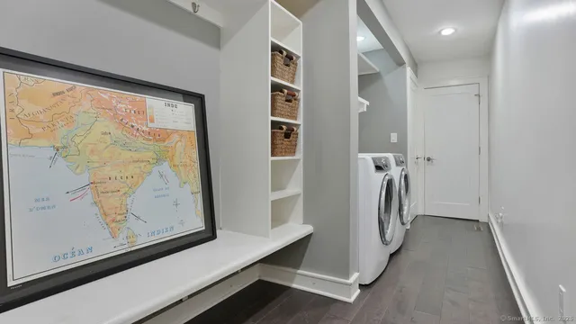 a view of a hallway with closet and front door